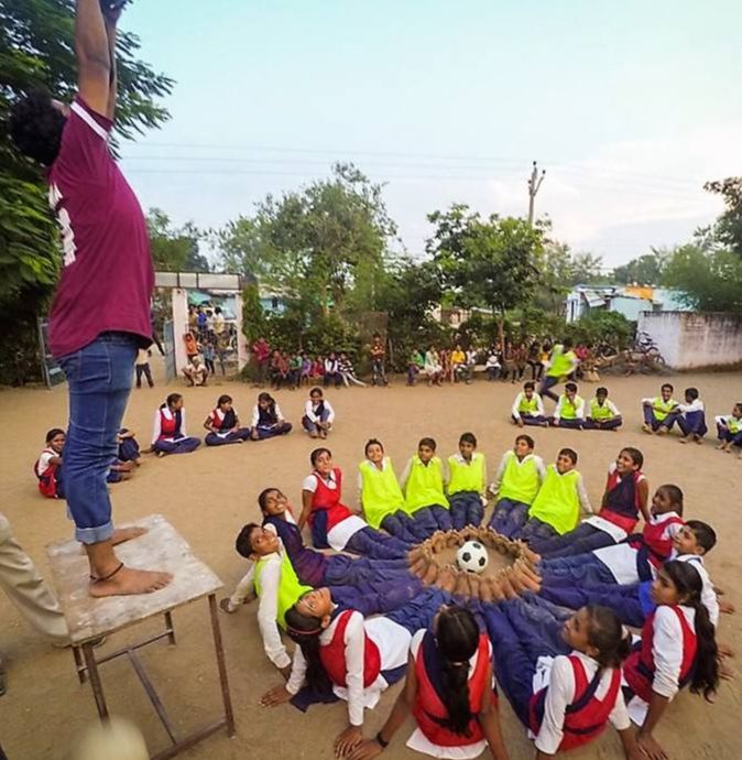 Sanskar Singh taking picture during documentation of Sports for Development Program in a government school of Dewas District.